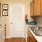 a kitchen with wooden cabinets