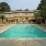 a swimming pool in front of a house